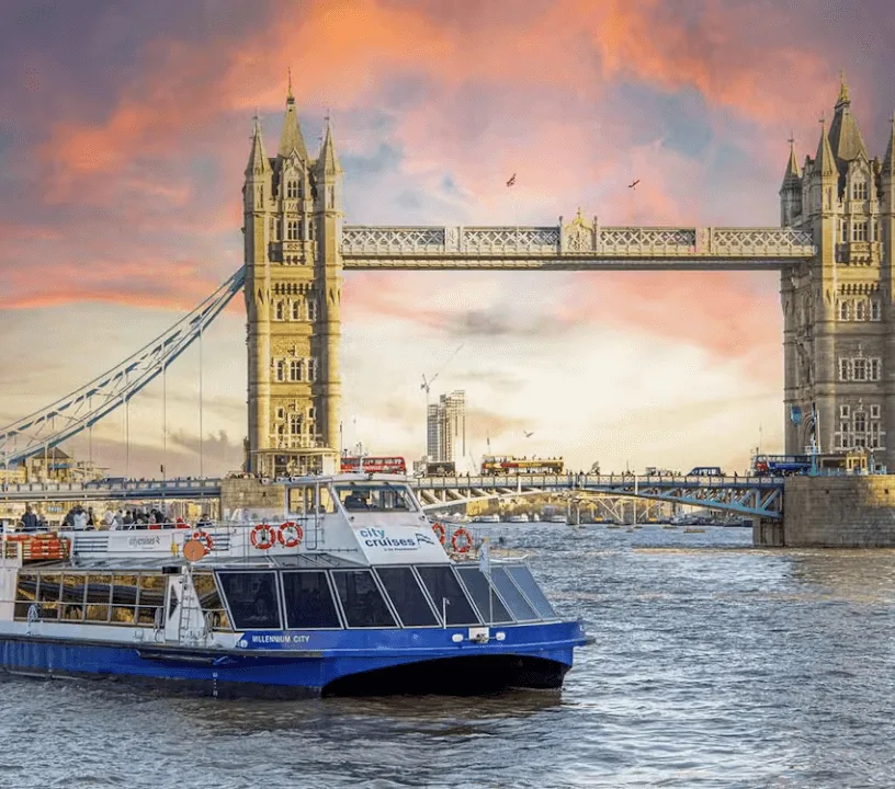 Thames cruise boat beneath Tower Bridge