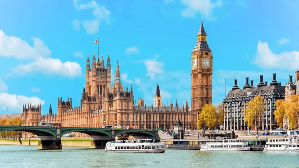 Thames sightseeing boats beside the Houses of Parliament and Big Ben