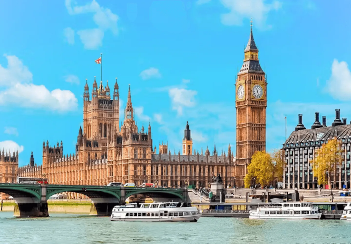 Thames sightseeing boats beside the Houses of Parliament and Big Ben